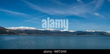 Beautiful blue sky over lake and mountains Stock Photo