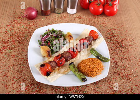 Meat and tomato kebabs with fresh peppercorns Stock Photo