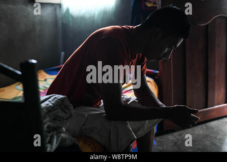 August 8, 2019, La Reforma, San Marcos, Guatemala: Since being deported from the U.S. eight days ago, Lisardo Perez, 19, spends his days staring at the floor of his familyâ€™s one-room house in The town of La Reforma, Guatemala. Lizardo said he does not even feel like going outside. The family had pinned all their hopes on him making it in the U.S., and now face losing their home due to an $8000 loan to pay Lizardoâ€™s smuggler, along with medical debt due to a sick son, and the prospect of life in one of the poorest corners of the continent. (Credit Image: © Miguel Juarez Lugo/ZUMA Wire) Stock Photo