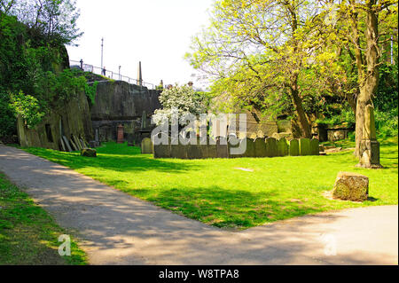 Old gravestones in St James' Garden in the grounds of Liverpool Anglican Cathedral Stock Photo