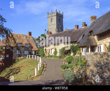 Thatched cottages and All Saints' Church, Godshill, Isle of Wight, England, United Kingdom Stock Photo