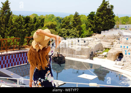 Portrait of young woman with hat in Syracuse (Siracusa) Greek theatre, Sicily, Italy Stock Photo