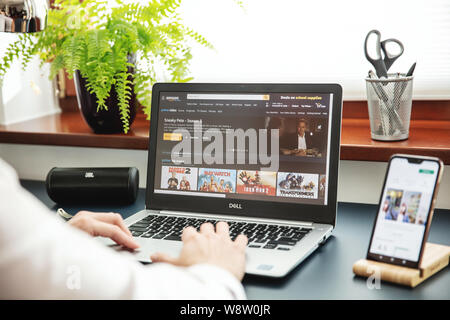 WROCLAW, POLAND - JULY 31th, 2019: Modern laptop on the desk in office with Amazon Prime application on the screen.  Amazon Prime Video, is an America Stock Photo