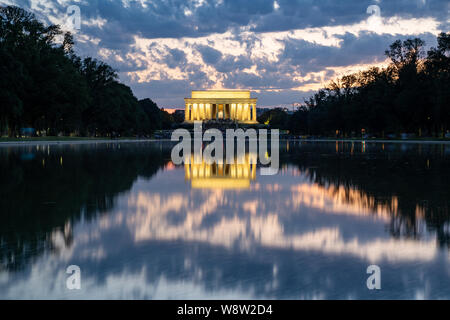 Lincoln memorial reflected in the reflecting pool on the National Mall at dusk sunset. Long exposure Stock Photo