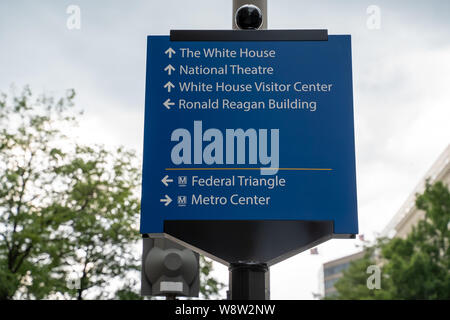 Washington, DC - August 7, 2019: Sign gives directions to famous DC landmarks for tourists (White House, National Theater, DC Metro Subway) in downtow Stock Photo