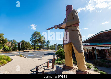 Big Ned Kelly, this large statue of bushranger Ned Kelly in his iconic metal armour is in the country town of Glenrowan in rural Victoria Australia Stock Photo