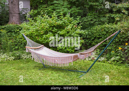 Hammock in residential backyard in summer Stock Photo