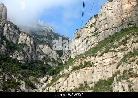 Yellow cable car to the Church of Santa Maria de Montserrat in the mountains of Montserrat near Barcelona, Spain, Catalonia. Stock Photo