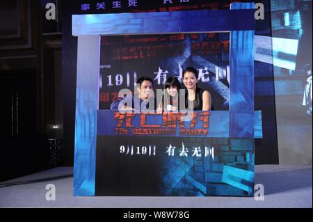 (From left) American actor Archie Kao, Chinese child star Zhang Zimu and Hong Kong actress Anita Yuen pose during a press conference for their new mov Stock Photo