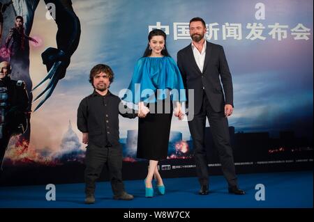 (From left) American actor Peter Dinklage, Chinese actress Fan Bingbing and Australian actor Hugh Jackman pose during a press conference for their new Stock Photo