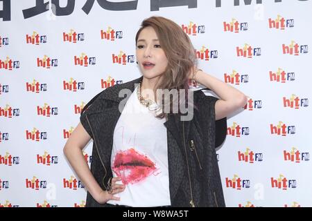 Taiwanese singer Elva Hsiao poses during an interview at Hit FM radio station in Taipei, Taiwan, 5 August 2014. Stock Photo