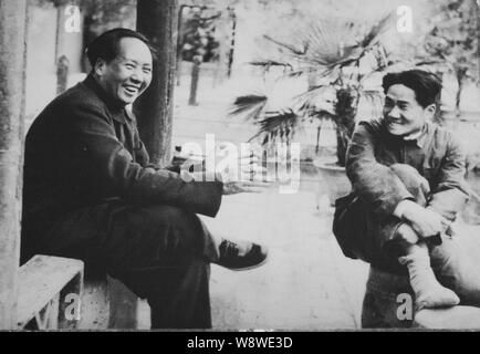 This picture shows a photos of Mao Zedong, left, founding father of ...