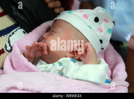 Peng Ankang, a baby whose weight was 0.8kg when he was born on June 17, is pictured at the Louxing People's Hospital in Loudi city, central Chinas Hun Stock Photo