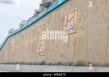 Santa Fe, USA - June 17, 2019: Road US Highway 285 in New Mexico with closeup of decorations design colorful artwork on walls Stock Photo