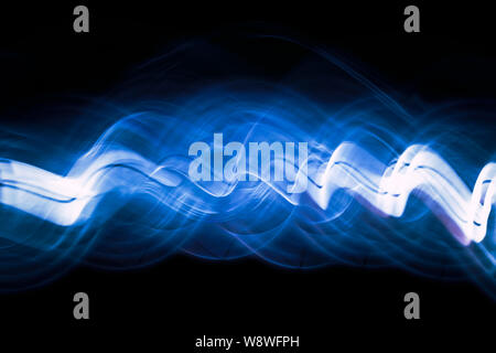Sound waves in the dark in blue color Stock Photo