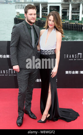 Irish-American actor Jack Reynor, left, and his model fiancee Madeline Mulqueen pose on the red carpet for the world premiere of the movie, Transforme Stock Photo