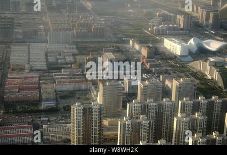 --FILE--Aerial view of residential houses and apartment buildings in Hohhot city, north Chinas Inner Mongolia Autonomous Region, 4 September 2013.   C Stock Photo