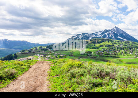 Crested Butte, Colorado Snodgrass hiking trail in summer with path leading to mountain view and town village Stock Photo