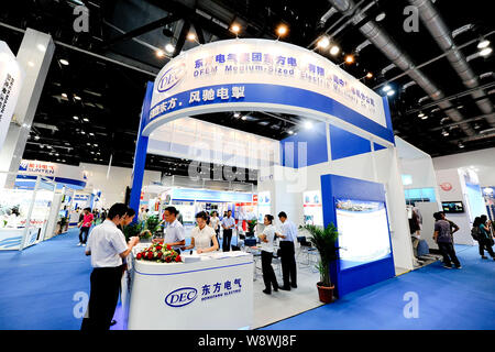 --FILE--People visit the stand of Dongfang Electric Corporation (DEC) during the 2011 Clean Energy China Exhibition in Beijing, China, 22 June 2011. Stock Photo