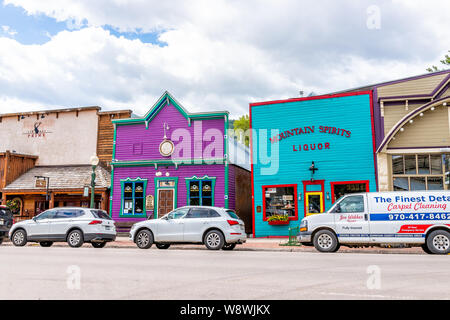 Crested Butte, USA - June 21, 2019: Colorado colorful vibrant village houses stores shopping downtown in summer with vintage mountain architecture and Stock Photo