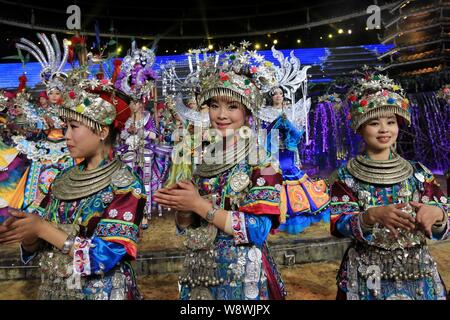 --FILE--Participants of Dong ethnic minority perform at a play in Dong Village, Sanjiang Dong Autonomous County, south Chinas Guangxi Zhuang Autonomou Stock Photo