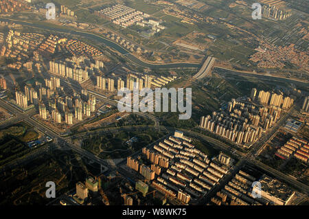 --FILE--Aerial view of residential houses and apartment buildings in Hohhot city, north Chinas Inner Mongolia Autonomous Region, 4 September 2013.   C Stock Photo