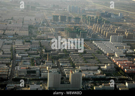 --FILE--Aerial view of residential houses and apartment buildings in Hohhot city, north Chinas Inner Mongolia Autonomous Region, 4 September 2013.   C Stock Photo