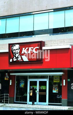 --FILE--A customer enters a KFC fastfood restaurant of Yum Brands in Shanghai, China, 4 May 2013.       Western food chains are targeting Chinas break Stock Photo