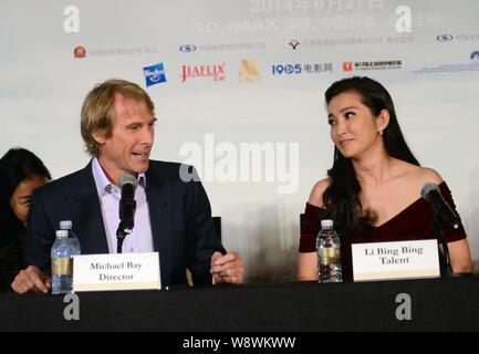 American director Michael Bay, left, and Chinese actress Li Bingbing attend a press conference for their movie, Transformers: Age of Extinction, durin Stock Photo