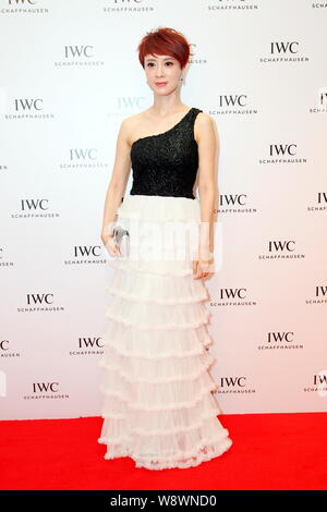 Chinese actress Jin Qiaoqiao poses on the red carpet as she arrives for the IWC 'Timeless Portofino' banquet in Hong Kong, China, 29 September 2014. Stock Photo