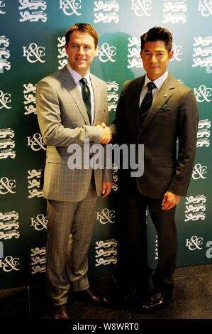 English football star Michael Owen, left, shakes hands with Hong Kong singer and actor Aaron Kwok at the Kent & Curwen Centenary Sprint Cup horse race Stock Photo