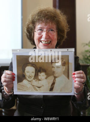 Wartime refugee Sonja Muhlberger, 75, shows a photo of her family at the Shanghai Jewish Refugees Museum in Shanghai, China, 2 September 2014.   A mem Stock Photo