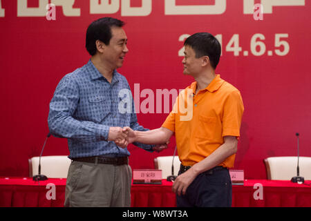 Jack Ma Yun, right, Chairman of Alibaba Group, shakes hands with Xu Jiayin (Hui Ka Yan), Chairman of Evergrande Group, during a signing ceremony for A Stock Photo