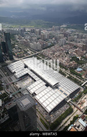 This picture taken from high in the Ping An International Finance Center Tower under construction shows a view of the Shenzhen Convention & Exhibition Stock Photo