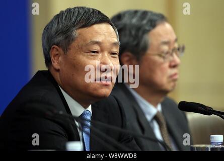 Xiao Gang, front, Chairman of the China Securities Regulatory Commission (CSRC), speaks next to Zhou Xiaochuan, Governor of the Peoples Bank of China Stock Photo