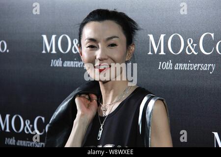 Hong Kong actress Maggie Cheung poses at a fashion event for the 10th anniversary of MO&Co. in Guangzhou city, south Chinas Guangdong province, 18 Jul Stock Photo