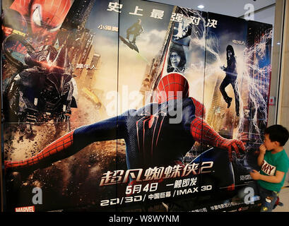 FILE--A young Chinese boy looks at a poster of the movie, The Amazing  Spider-Man 2, at a cinema in Yichang city, central Chinas Hubei province, 1  Ma Stock Photo - Alamy