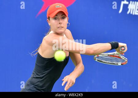 Alize Cornet of France returns a shot to Shahar Peer of Israel at their second round match of the women's singles during the 2014 WTA Guangzhou Open t Stock Photo