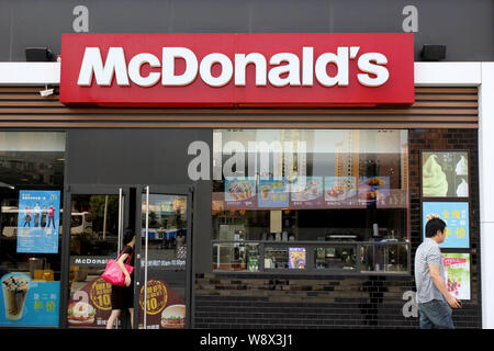 --FILE--A customer enters a McDonald¯s fastfood restaurant in Wuhan city, central Chinas Hubei province, 3 September 2014.      McDonald¯s Corp., the Stock Photo