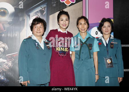 Hong Kong actress Miriam Yeung, second left, poses at a charity event of Hong Kong Girl Guides Association in Hong Kong, China, 18 September 2014. Stock Photo