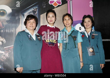 Hong Kong actress Miriam Yeung, second left, poses at a charity event of Hong Kong Girl Guides Association in Hong Kong, China, 18 September 2014. Stock Photo