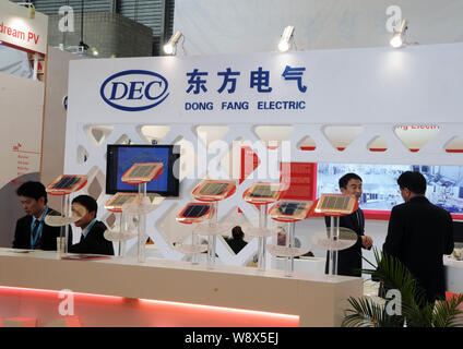 --FILE--People visit the stand of Dongfang Electric Corporation (DEC) during the SNEC 5th (2011) International Photovoltaic Power Generation Conferenc Stock Photo