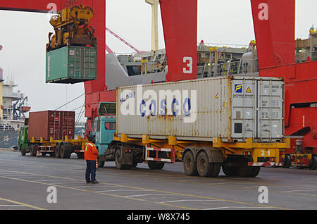 --FILE--A truck transports a container of COSCO to be shipped abroad at the Port of Rizhao in Rizhao city, east Chinas Shandong province, 29 December Stock Photo
