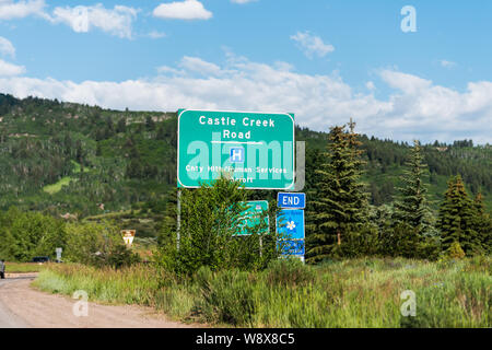 Aspen, USA - June 27, 2019: Town in Colorado with road sign for castle creek and hospital during summer day and nobody Stock Photo