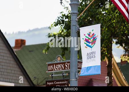 Aspen, USA - June 27, 2019: Colorado town city with closeup of sign on Main street for ideas festival and community church Stock Photo