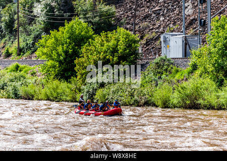 Glenwood Springs, USA - June 29, 2019: Group of people white water rafting in Colorado town in Roaring Fork River Stock Photo