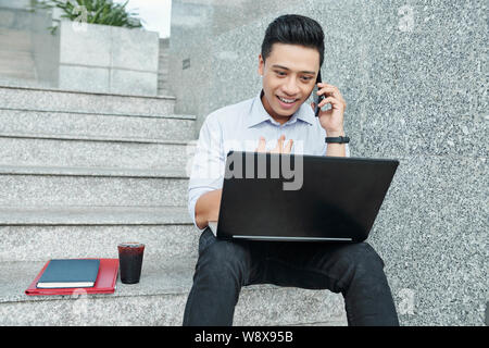 University student sitting on steps Stock Photo
