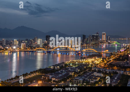 Overview of Danang city at dusk and night time, Vietnam