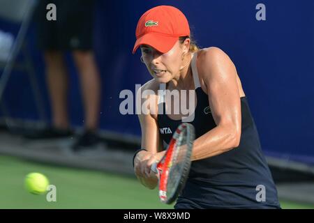 Alize Cornet of France returns a shot to Shahar Peer of Israel at their second round match of the women's singles during the 2014 WTA Guangzhou Open t Stock Photo