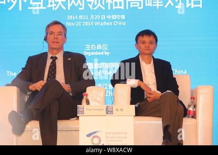 Jack Ma Yun, right, Chairman of Alibaba Group, and Paul E. Jacobs, CEO of Qualcomm, attend the Chinese and Foreign Entrepreneurs Summit during the Fir Stock Photo